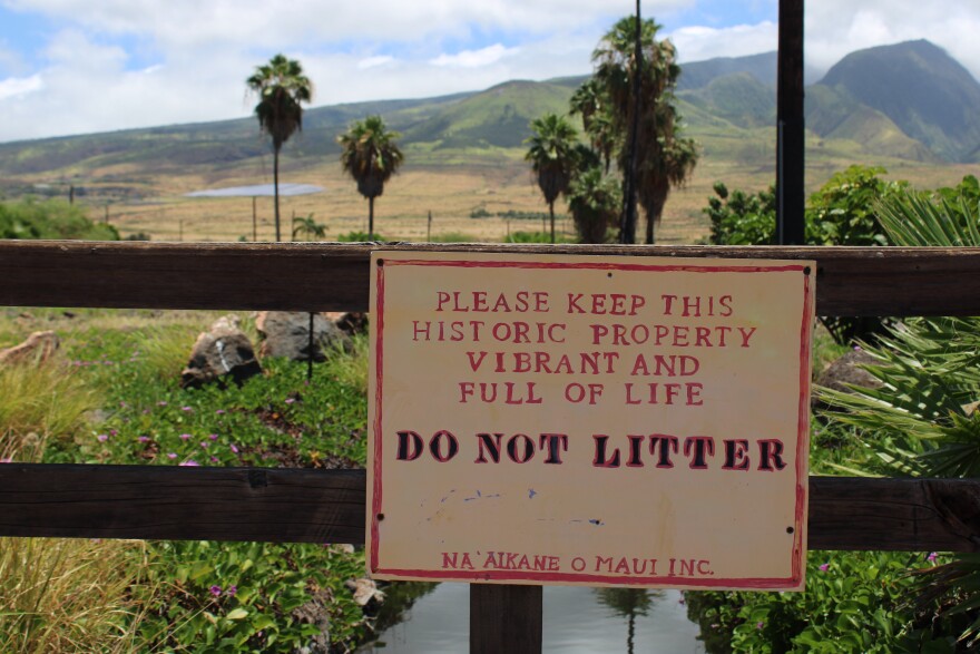 A sign from Nā 'Aikāne o Maui, that reads "Please keep this historic property vibrant and full of life" in front of Mokuʻula in Lahaina, Maui. 