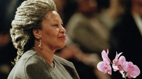 In this April 5, 1994 file photo, Toni Morrison holds an orchid at the Cathedral of St. John the Divine in New York. The Nobel Prize-winning author has died. (Kathy Willens/AP File Photo)