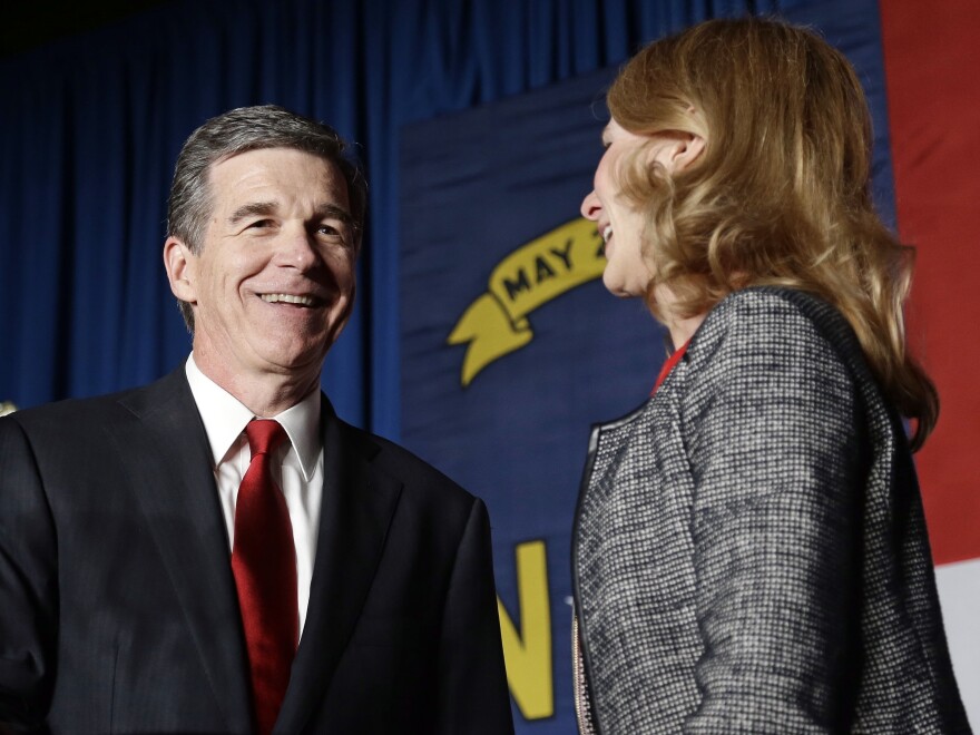 Democratic Gov.-elect Roy Cooper defeated incumbent Pat McCrory in a tight election. Cooper is seen here with his wife, Kristin, at an election night rally in Raleigh.