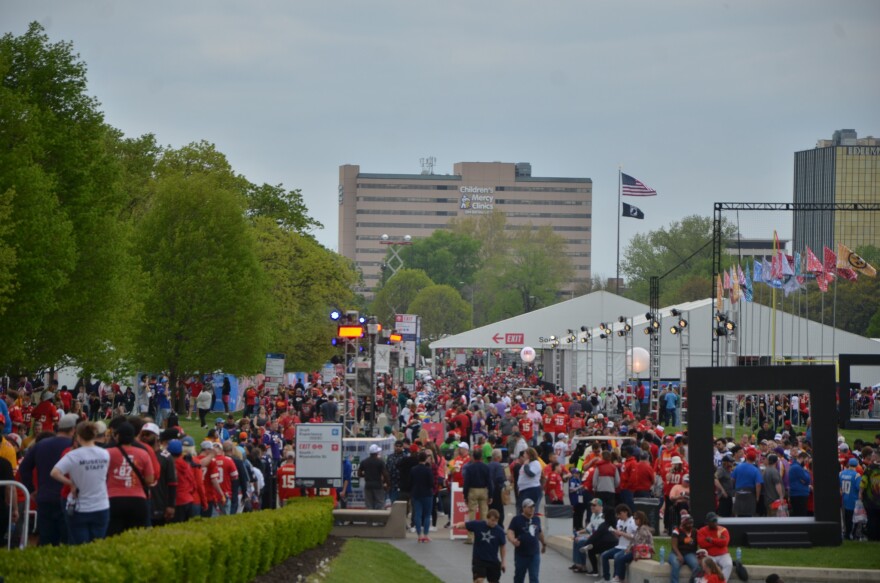  A crowd of fans enter the NFL Draft experience.