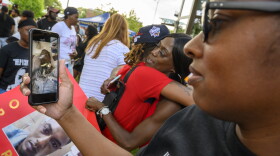 In July, 2022, as hundreds gathered to march through New Haven for Randy Cox, LaToya Boomer (right), used a video call to show her brother Randy the crowd gathered in his name.