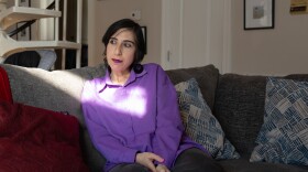 Tamar Shirinian sits on the couch in her Knoxville home on Wednesday, Nov. 26, 2025. Shirinian is a cultural anthropologist who had previously worked for 6 years as an assistant professor at the University of Tennessee until she was fired for making a private Facebook comment critical of conservative activist Charlie Kirk after his Sept. 10 assassination.