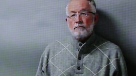 William Strampel, pictured in March 2018, was convicted Wednesday in part over his role in the handling of complaints against the former sports doctor Larry Nassar. He was cleared of a more serious criminal sexual conduct charge.