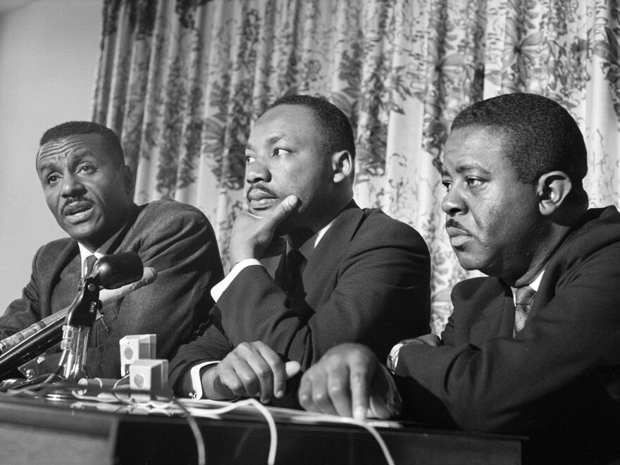 Civil rights leaders (left to right) Fred Shuttlesworth, Martin Luther King, Jr. and Ralph Abernathy at press conference during Birmingham Campaign, Birmingham, Ala. on May 16, 1963.