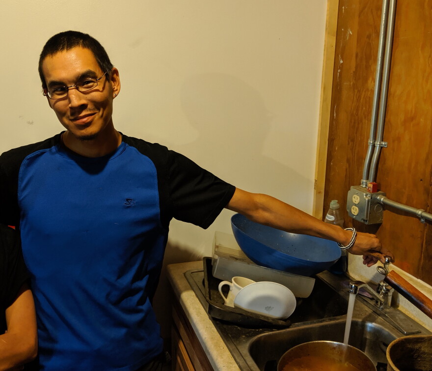 Artie Kameroff shows off his new sink, complete with running water.