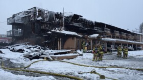 Firefighters put out the smoldering blaze at Royal Suites Apartments in midtown Anchorage on Feb. 15, 2017. (Hillman/Alaska Public Media)