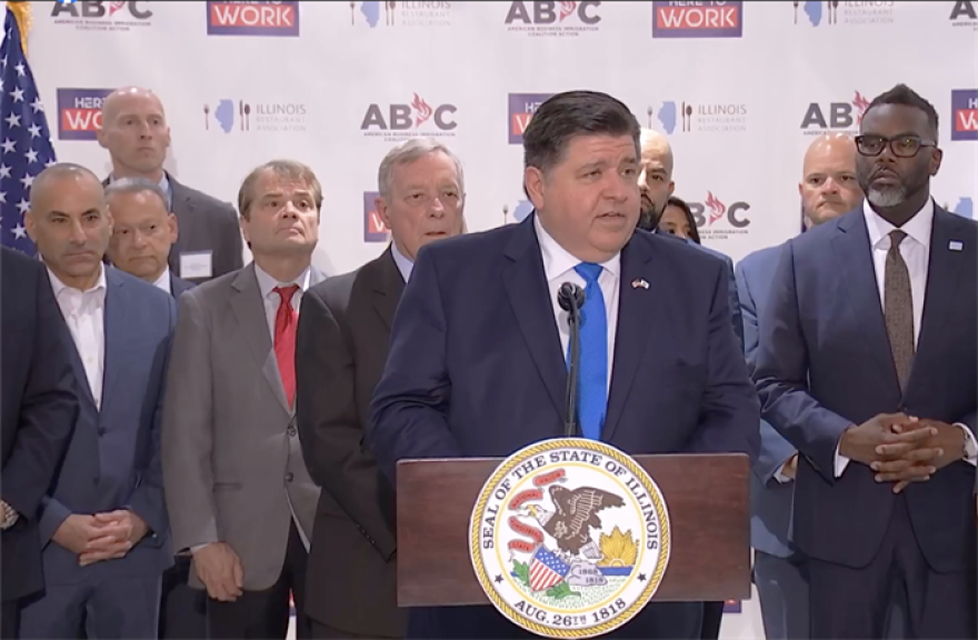 Gov. JB Pritzker at a Chicago news conference Wednesday, advocating for the federal U.S. Department of Homeland Security to allow Illinois and other states to sponsor work permits for asylum seekers and other long-term undocumented workers.