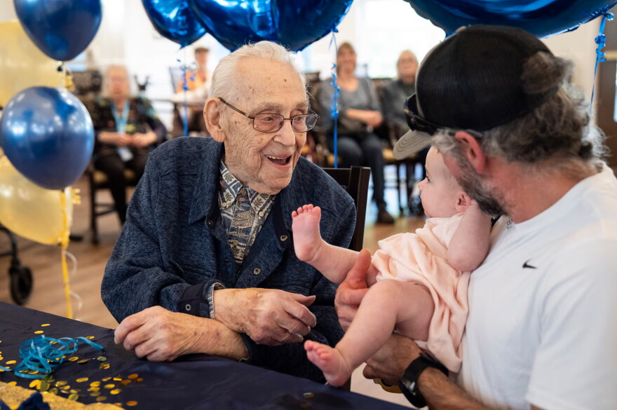 Beryl Dillman, 108, greets his newest great-grandchild Bella Rose Sturges at his birthday celebration on Oct. 1, 2026 in Eugene, Ore. Dillman's family believes he could be the oldest living man in the state of Oregon.
