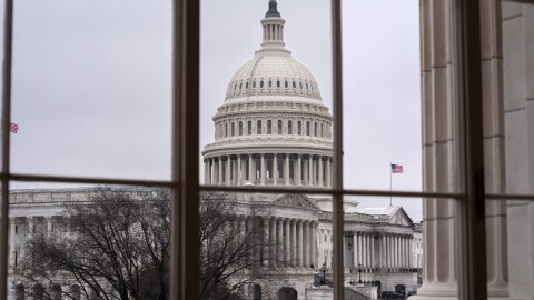 The Capitol is seen framed through a window in the Cannon House Office Building on Capitol Hill in Washington, Thursday, Feb. 13, 2025. (AP Photo/J. Scott Applewhite)