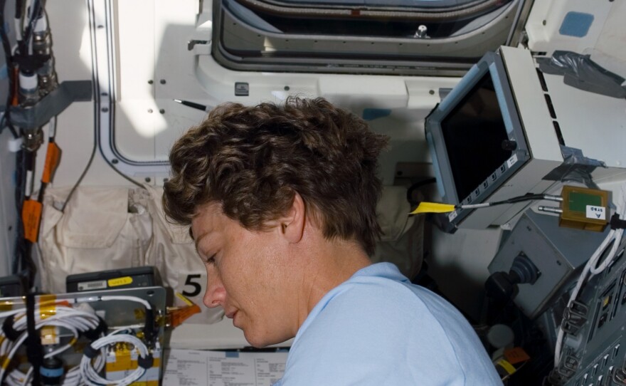 STS-114 Commander Eileen Collins is photographed under the aft flight deck windows as she makes preparation for docking with the International Space Station ISS
