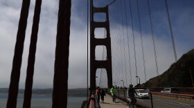 Cyclists ride by the north tower of the Golden Gate Bridge on June 28, 2016 in San Francisco, California. (Justin Sullivan/Getty Images)