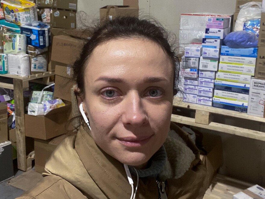 Aleksandra Shchebet took this selfie in a warehouse in Lutsk where for months she spent long days packing up donated food and medical supplies. She has now returned to Kyiv to treat patients.