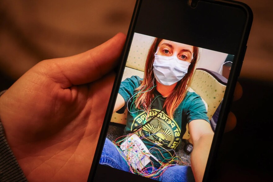  Nina Shand shows a photo of herself on her phone from when she was in a sleep study testing for narcolepsy. For those with sleep disorders, like Shand, the effects of the Adderall shortage can be consequential. Basic tasks — like driving — can become dangerous or impossible without medication. 