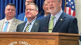North Carolina Senate leader Phil Berger, R-Rockingham, right, speaks about a budget agreement reached with House Speaker Tim Moore, R-Cleveland, center, at a Legislative Building news conference in Raleigh, N.C. on Tuesday, June 28, 2022.