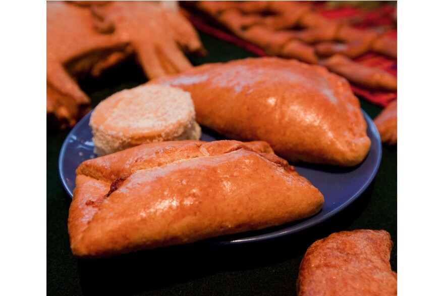 Pan de Muertos: Semisweet breads are baked with a small human figurine inside. It's considered good luck to find the tiny surprise in your slice. Breads are also used to represent the soil.