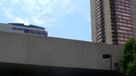 Emergency vehicles line the street as firefighters engage a high-rise fire at the San Francisco Towers.