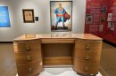 The “Icons in Ink’’ exhibition at the Maltz Museum includes the writing desk of Jerry Siegel, co-creator of Superman along with Joe Shuster, and a 1940s vintage Superman advertising painting.