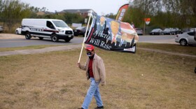Supporters of U.S. President Donald Trump hold a rally while waiting for Trump's arrival in McAllen, Texas, on January 12, 2021. (Mark Felix/AFP via Getty Images)
