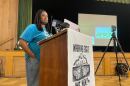 Ingrid Walker-Henry listens to a member of the audience speak at a town hall protesting budget cuts at Milwaukee Public Schools at Washington Park Senior Center on April 21, 2026.