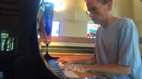 Joel Ainsworth plays piano at St. Patrick’s Catholic Church on Wednesday morning. In addition to playing piano in the 11 a.m. mass, Ainsworth also gives piano lessons to students during the week days. Photo by Sarah Kimbro.