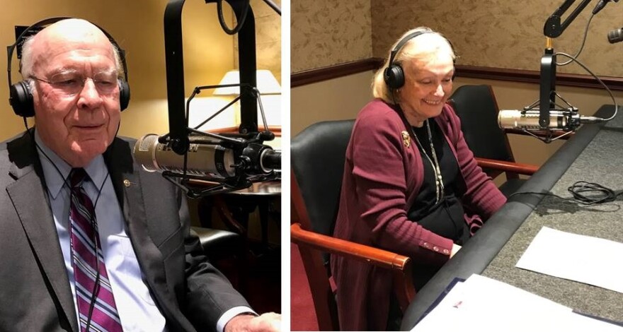 A split image of Sen. Patrick Leahy, left in a gray suit, speaking into a microphone in the US Senate studio, and his wife Marcelle to the right, also speaking into a mic and wearing black headphones and a maroon sweater.