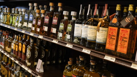 Shelves display bottles of tequila for sale at a liquor store