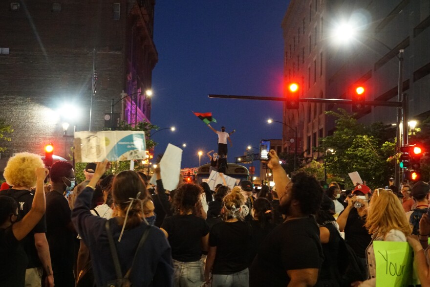 Protesters congregate and wave flags near Washington Avenue to protest the death of George Floyd. May 29, 2020