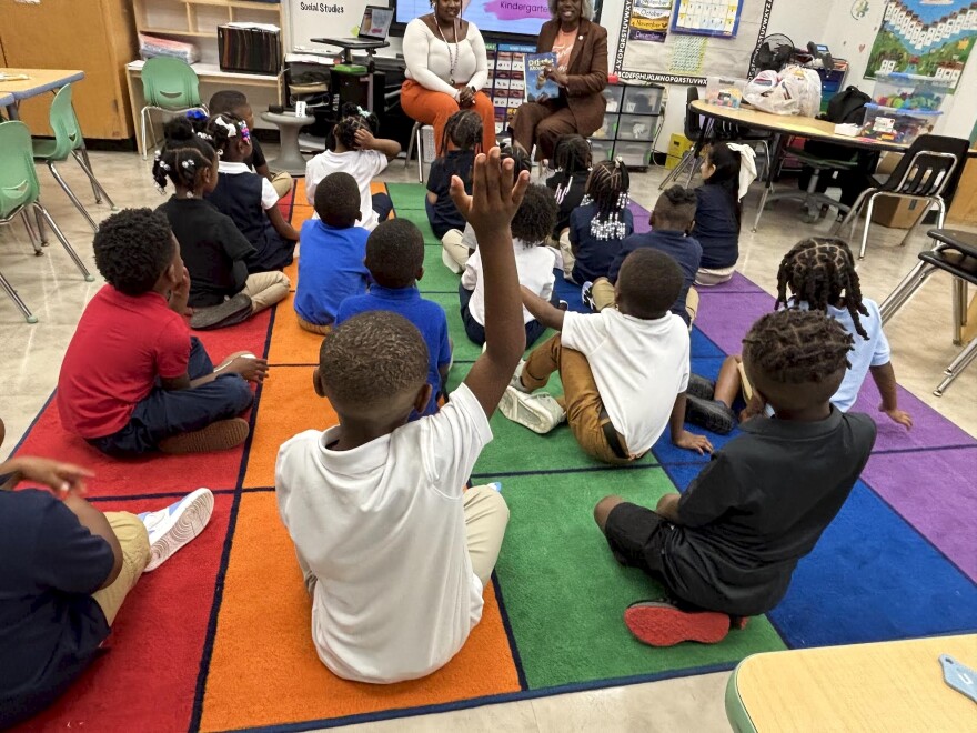 A student raises his hand in a kindergarten classroom in Oklahoma City on Aug. 13.
