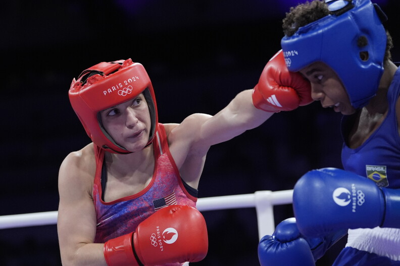 United States' Alyssa Mendoza hits Brazil's Jucielen Cerqueira in their women's 57 kg preliminary boxing match at the 2024 Summer Olympics, Friday, Aug. 2, 2024, in Paris, France.