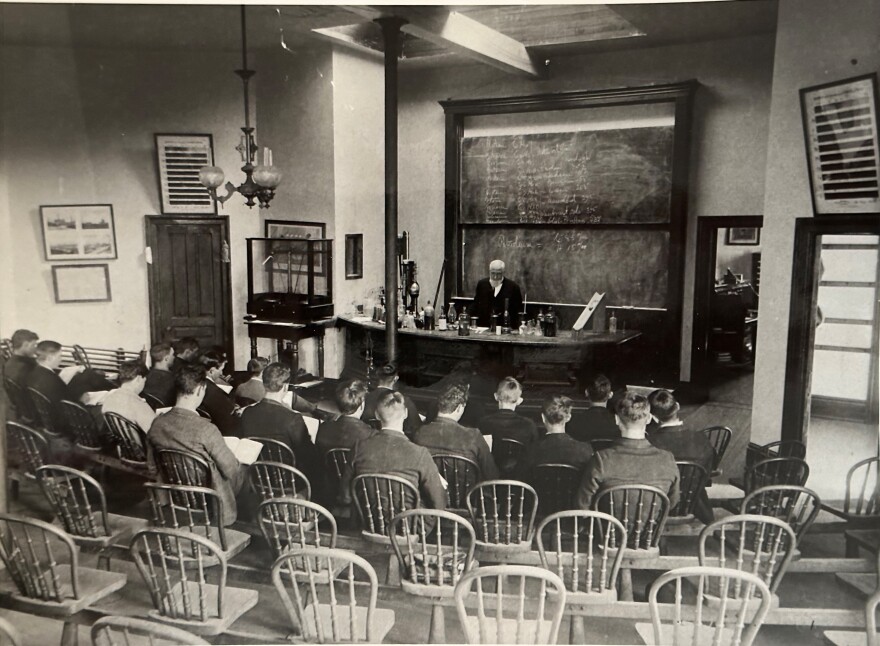 Professor Robert Kedzie giving an address at his MSU laboratory