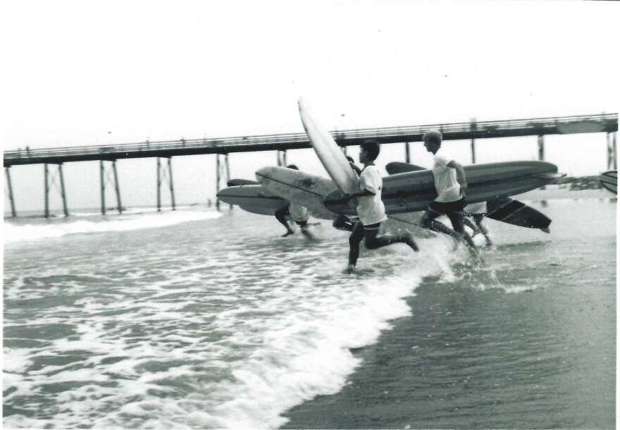 Surfers run to the water at one of the first East Cost Surfing Championships in Virginia Beach in the 1960s.