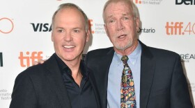Journalist Walter Robinson stands with Michael Keaton, the actor who portrayed Robinson in the Oscar-winning film, "Spotlight."