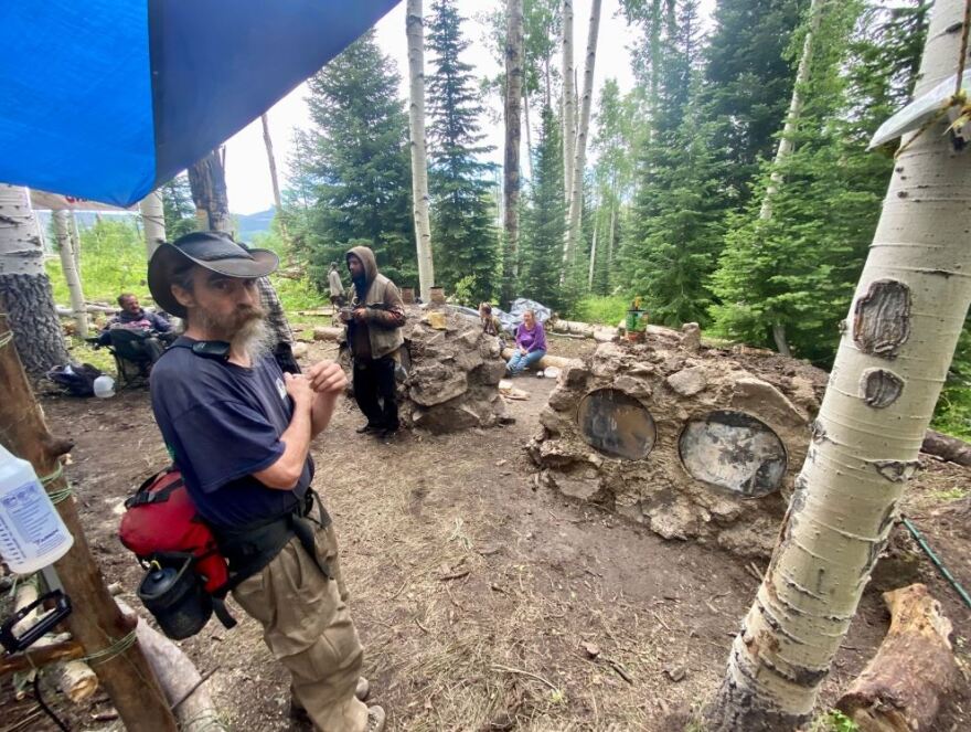 Rob Savoye visits the Lovin’ Ovens kitchen at the 50th annual Rainbow Family gathering in the Routt National Forest. Volunteers with the Lovin’ Ovens kitchen bake thousands of rolls and pizzas in ovens built from locals rocks and mud. The ovens will be destroyed when the group leaves the forest.