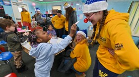 Addyson Swayne, a Wilkes University field hockey player, jokes with Kistler student Aeryn Alexander.