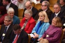 Members of the Church of England's Synod react after a vote to formalize the approval of consecrating women as bishops in central London Monday. The Church of England's governing body on Monday adopted a historic measure allowing women to become bishops.