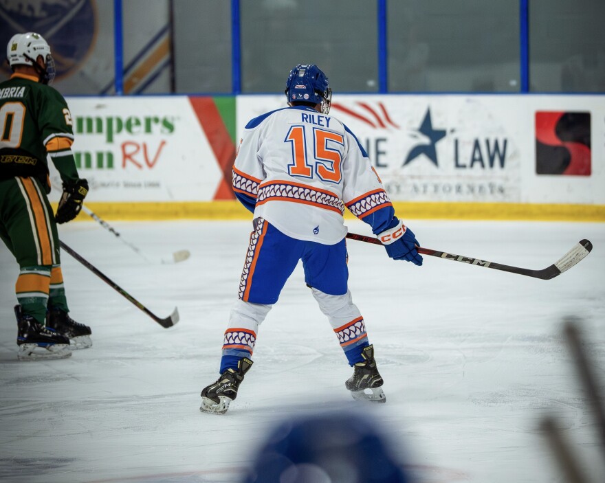 Aadyn Riley, the team's marketing department head, focused on the game.