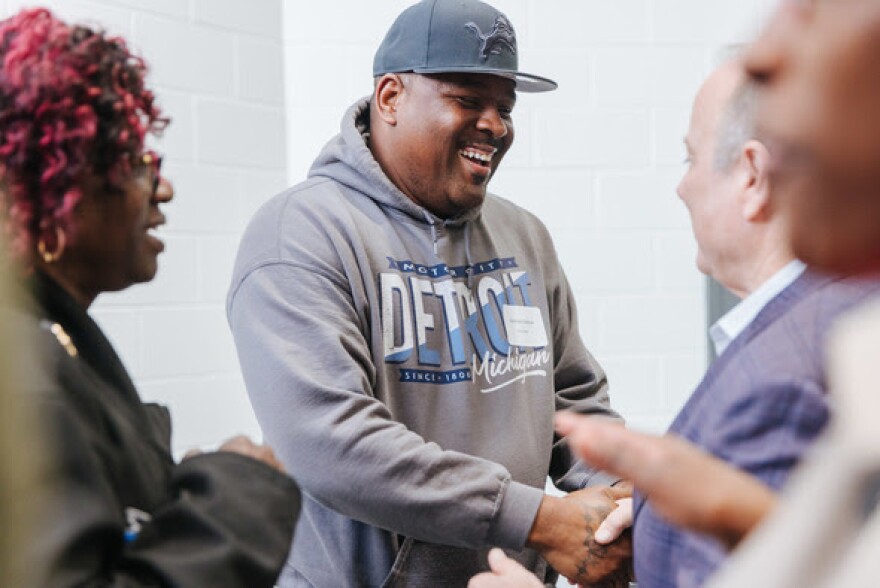 Detroiter Nicholas DuBose, here with Mayor Mike Duggan, says Project Clean Slate has impacted his life in profound ways both big and small.