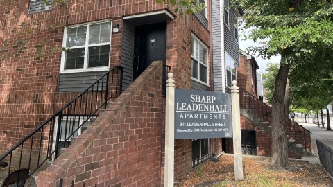 Sign outside of Sharp Leadenhall Apartments in Baltimore, Maryland.  Credit: Matt Bush/Baltimore Public Media