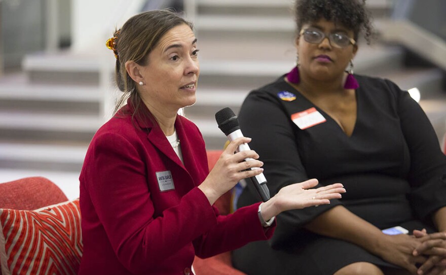 Anita Earls, left, a candidate for the North Carolina Supreme Court, talks with Mavis Gragg, right, and a group of women during a Sister to Sister salon conversation at the Chesterfield in Durham on Friday, October 26, 2018. 