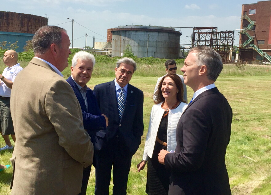 Local, state, and federal officials gathered on the New Bedford waterfront Tuesday as the U.S. Environmental Protection Agency announced that federal money has been set aside to finish the New Bedford Harbor cleanup. Speakers emphasized the transformation represented by not only the harbor, but also the former energy plant where the event was held, which is slated to be redeveloped as an offshore wind terminal.