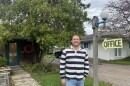 George Brittain, standing outside the office of the Anchor Inn on West Bay in Traverse City. It’s a renovated historic motel, just across the road from the beach. (Photo: Claire Keenan-Kurgan/IPR News)