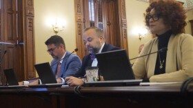 Rep. Camille Lilly, right, testifies before a House committee for passage of a bill calling for an audit of the federal 340B drug pricing program in Illinois. Also testifying were Peter Fotos, left, of Pharmaceutical Research and Manufacturers of America, and John Conrad of the Illinois Biotechnology Industry Organization.