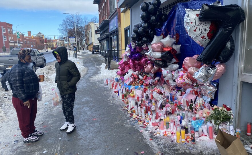 Kierra Allen visits Shanita Thomas’ vigil on Central Avenue in Albany, NY every day. She is pictured here with her son.