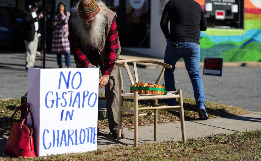 Protestors set up outside of Manolo’s Bakery amidst federal law enforcement, Monday, Nov. 17, 2025, in Charlotte, N.C.