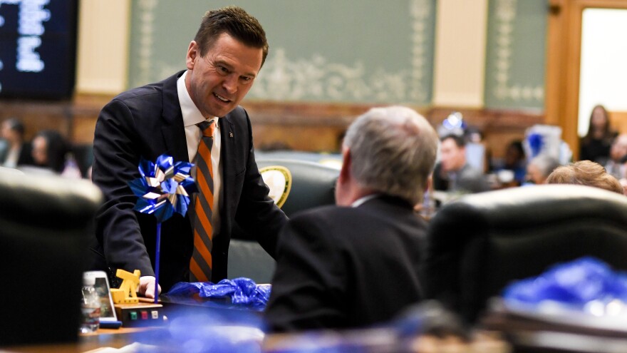 Colorado State Rep. Cole Wist speaks to State Rep. Larry Liston at the Colorado State Capitol on April 25, 2018. Wist, a Republican, is one of the sponsors of a bill that would allow guns to be temporarily taken away from someone who is a significant risk to themselves or to others.