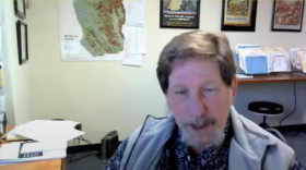A man talking in an office.