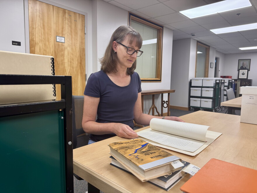 Colorado State University archivist Patty Rettig sifts through the minutes of the meetings that led to the 1922 Colorado River Compact. The compact, while controversial, has shaped Western water for more than a century.