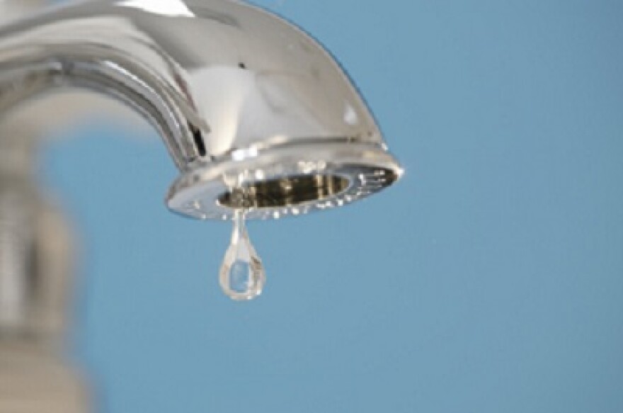 A dripping water faucet.