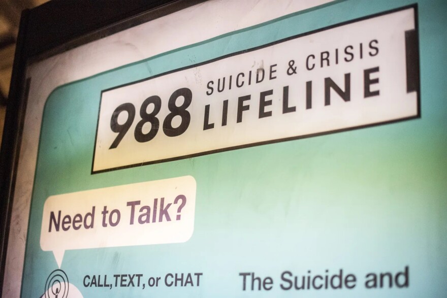 An advertisement for the Suicide & Crisis Lifeline’s 988 hotline is seen at the Shaw-Howard University subway station in Washington, D.C.