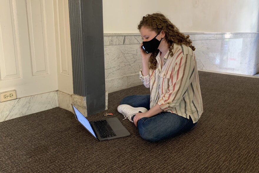 Common Cause worker Dana Abelson calls voters in Florida from her apartment building in Washington, D.C., to help them fix problems with their absentee ballots in advance of Election Day.